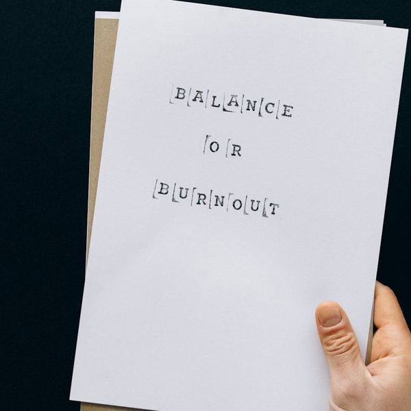 Person looking towards a bright horizon, symbolizing clarity and well-being.